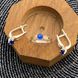 Комплект серебряный с золотыми вставками кольцо и сережки с синими фианитами